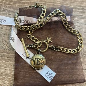 Gold chain necklace with yes/no pennant